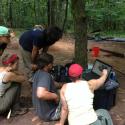 Archaeology students analyse data.