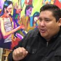 Brent Learned in front of one of his paintings